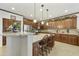 Well-appointed kitchen boasting wood cabinetry, granite countertops, and stainless steel appliances at 4615 W Corral Rd, Laveen, AZ 85339