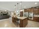 Spacious kitchen with granite island, stainless steel appliances and bar stool seating at 4615 W Corral Rd, Laveen, AZ 85339