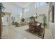 Spacious living room features high ceilings, neutral decor, and an adjacent dining area at 4615 W Corral Rd, Laveen, AZ 85339