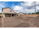 Large backyard with a covered patio and a view of a block wall at 6537 W Riva Rd, Phoenix, AZ 85043