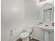 Clean and bright bathroom with pedestal sink and updated fixtures at 6537 W Riva Rd, Phoenix, AZ 85043
