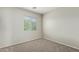 Simple bedroom with neutral walls and carpeted floor at 6537 W Riva Rd, Phoenix, AZ 85043