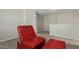 Red chair and ottoman in bedroom at 6537 W Riva Rd, Phoenix, AZ 85043