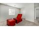 Bedroom with red chair and ottoman at 6537 W Riva Rd, Phoenix, AZ 85043