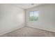 Bright bedroom featuring neutral walls and carpet at 6537 W Riva Rd, Phoenix, AZ 85043