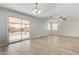 Spacious dining area with sliding door to backyard and laminate flooring at 6537 W Riva Rd, Phoenix, AZ 85043