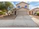Tan two-story house with a two-car garage and driveway at 6537 W Riva Rd, Phoenix, AZ 85043