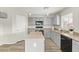 Modern kitchen with gray cabinets, an island, and stainless steel appliances at 6537 W Riva Rd, Phoenix, AZ 85043