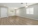 Bright living room with wood-look floors and neutral walls at 6537 W Riva Rd, Phoenix, AZ 85043