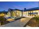 Charming outdoor area with travertine pavers, a water feature, and modern lighting at 6836 E Hummingbird Ln, Paradise Valley, AZ 85253