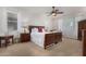 Main bedroom with ceiling fan, large bed, and wood furniture at 8718 N 180Th Dr, Waddell, AZ 85355