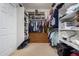 Large walk-in closet with ample shelving and hanging space at 8718 N 180Th Dr, Waddell, AZ 85355