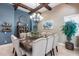 Elegant dining room featuring a large wooden table, chandelier, and comfortable seating at 9216 W Via Del Sol --, Peoria, AZ 85383