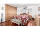 Bright bedroom offering wood flooring and built-in shelving at 9333 E University Dr # 147, Mesa, AZ 85207