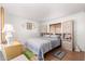 Cozy bedroom featuring wood floors and built-in storage at 9333 E University Dr # 147, Mesa, AZ 85207