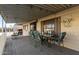 Covered patio with table, chairs, and southwestern decor at 9333 E University Dr # 147, Mesa, AZ 85207