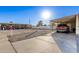 Carport and small yard with gravel driveway at 9333 E University Dr # 147, Mesa, AZ 85207