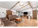 Living room with two leather sofas, coffee table, and wood floors at 9333 E University Dr # 147, Mesa, AZ 85207