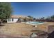 Spacious backyard with a refreshing pool and ample grassy area at 11503 W Cyprus Dr, Avondale, AZ 85392