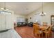 Bright dining area with hardwood floors and a wood table at 11503 W Cyprus Dr, Avondale, AZ 85392