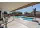 Covered patio overlooking a sparkling blue pool at 11503 W Cyprus Dr, Avondale, AZ 85392