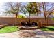 Landscaped backyard with patio and seating area at 117 E Blue Lagoon Dr, Casa Grande, AZ 85122