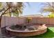 Landscaped backyard with raised garden beds at 117 E Blue Lagoon Dr, Casa Grande, AZ 85122