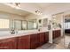 Large bathroom with double vanity and a walk-in shower at 117 E Blue Lagoon Dr, Casa Grande, AZ 85122