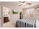 Serene bedroom with ensuite bathroom and a flat screen TV at 117 E Blue Lagoon Dr, Casa Grande, AZ 85122