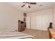 Comfortable bedroom with built-in dresser and ceiling fan at 117 E Blue Lagoon Dr, Casa Grande, AZ 85122