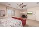 Main bedroom with sitting area and large window at 117 E Blue Lagoon Dr, Casa Grande, AZ 85122