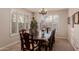 Formal dining room with large table and window shutters at 117 E Blue Lagoon Dr, Casa Grande, AZ 85122