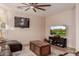 Gathering room with sectional sofa and large-screen TV at 117 E Blue Lagoon Dr, Casa Grande, AZ 85122