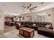 Gathering room with sectional sofa and view of kitchen at 117 E Blue Lagoon Dr, Casa Grande, AZ 85122