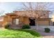 Two-story house with a stone facade and a landscaped lawn at 117 E Blue Lagoon Dr, Casa Grande, AZ 85122