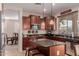 Modern kitchen with granite countertops and an island breakfast bar at 117 E Blue Lagoon Dr, Casa Grande, AZ 85122