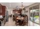 Spacious kitchen with island, stainless steel appliances, and dark wood cabinets at 117 E Blue Lagoon Dr, Casa Grande, AZ 85122