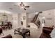 Open living area with a view of the kitchen and staircase at 117 E Blue Lagoon Dr, Casa Grande, AZ 85122