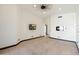 Bright bedroom with wall-mounted TV and ceiling fan at 11850 E Del Timbre Dr, Scottsdale, AZ 85259