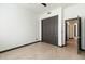 Bedroom with double doors and ceiling fan at 11850 E Del Timbre Dr, Scottsdale, AZ 85259