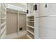 Large walk-in closet with shelving and hanging rods at 11850 E Del Timbre Dr, Scottsdale, AZ 85259