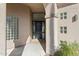 Elegant entryway with a dark wood door and glass block accents at 11850 E Del Timbre Dr, Scottsdale, AZ 85259