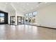 Spacious living room with tile floors and large windows at 11850 E Del Timbre Dr, Scottsdale, AZ 85259