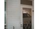 View of a covered carport and vehicle through a white metal security door at 12001 N Pebble Beach Dr, Sun City, AZ 85351