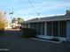 View of enclosed back porch and desert landscaping of the home at 12001 N Pebble Beach Dr, Sun City, AZ 85351