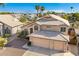 Two-story house with a three-car garage and landscaped yard at 1231 N Layman St, Gilbert, AZ 85233