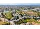 Aerial perspective of houses near a golf course and lake, offering scenic views at 1231 N Layman St, Gilbert, AZ 85233