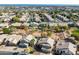 Aerial view of a residential area with houses, pools, and surrounding desert landscape at 1231 N Layman St, Gilbert, AZ 85233