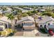 Aerial view of a house with a two-car garage and surrounding landscape at 1231 N Layman St, Gilbert, AZ 85233