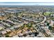 Aerial view of residential neighborhood near park and golf course with distant mountain views at 1231 N Layman St, Gilbert, AZ 85233